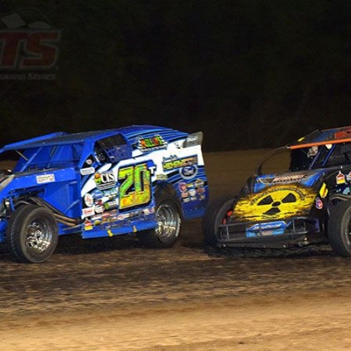 Current Gressel Racing driver Tanner Mullens leads former Gressel Racing driver Ricky Thornton Jr. during the feature race at the inaugural USMTS event at the Salina Speedway in Salina, Kan., on Thursday, June 8, 2017.